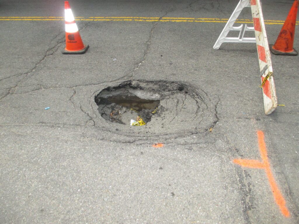 Broken Sewer  Leads to Hole In Street