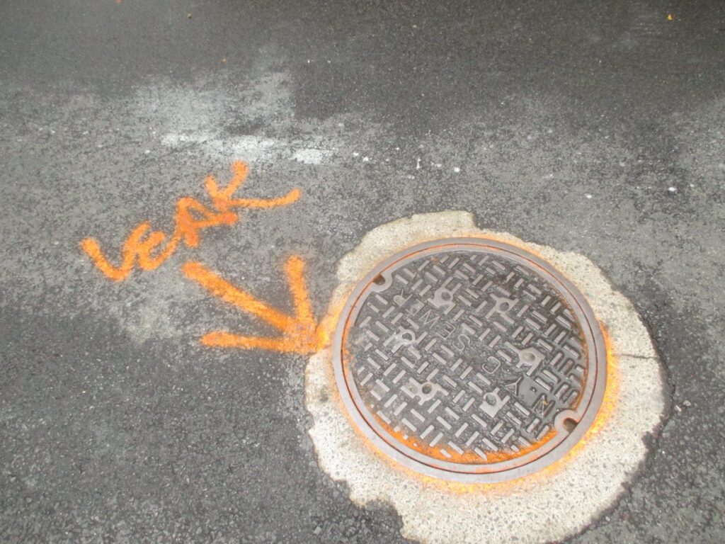 Water Line Leaks Into City Sewer Manhole