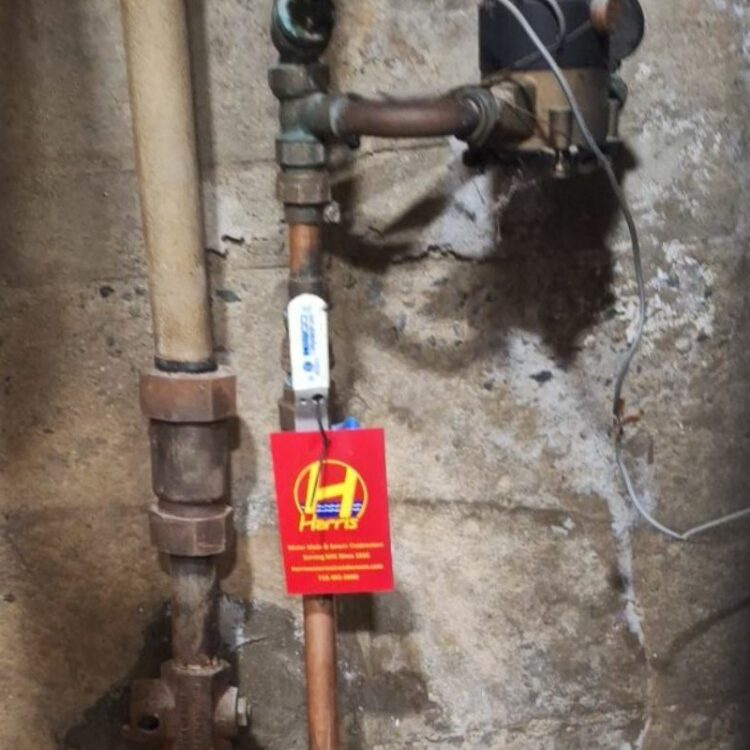 Sewer camera being inserted into a drain cleanout access point by Harris Water Main & Sewer Contractors Inc.