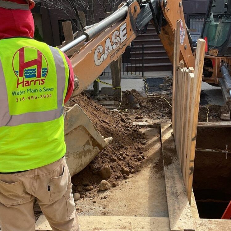Water main repair technician working in Manhattan street