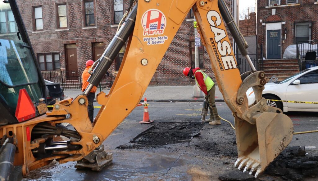Water main repair technician working in Queens NY