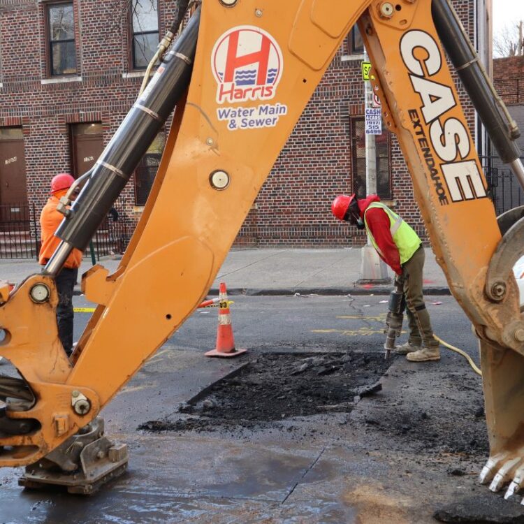 Water main repair technician working in Queens NY