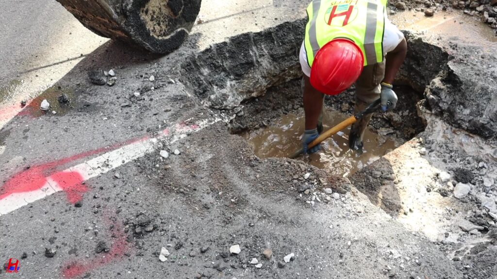 Technician reviewing a detailed video recording of a sewer line blockage.