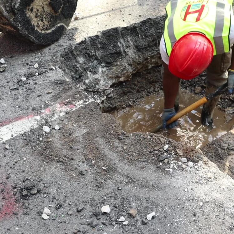 Technician reviewing a detailed video recording of a sewer line blockage.